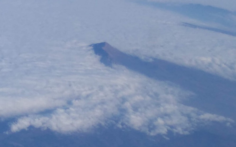 The tip of Mount Olympus showing through the clouds - taken from the aeroplane
