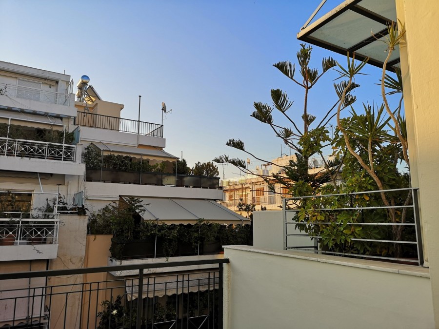 Urban white-washed balconies with plants