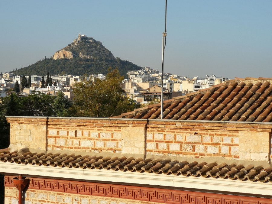 The peak of Lycabettus mountain with city in front