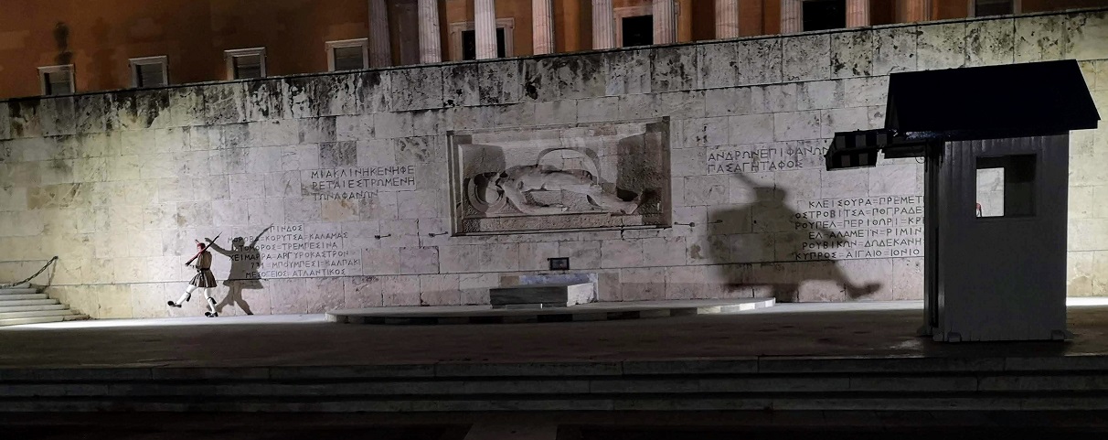 The Tomb of the Unknown Soldier with soldiers and their shadows marching in front