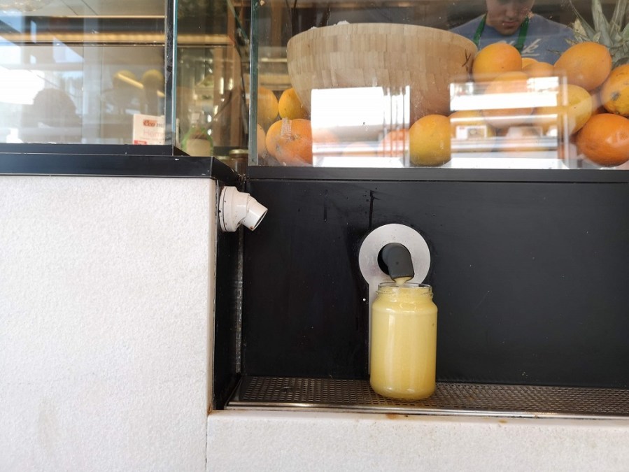 fresh fruit juice served in a jar
