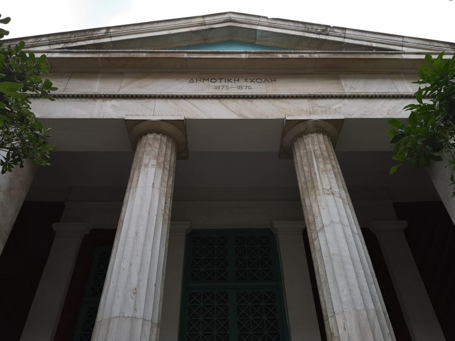 Classical Greek facade of school with columns and triangular roof, Athens