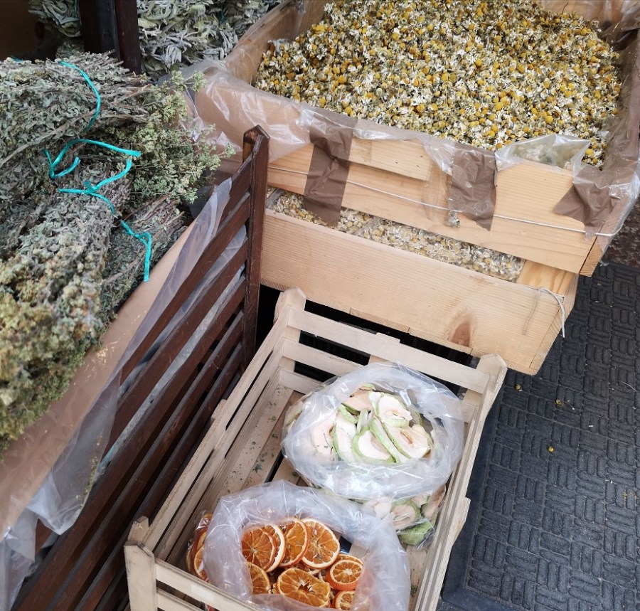 Wooden crates of spices and bunches herbs