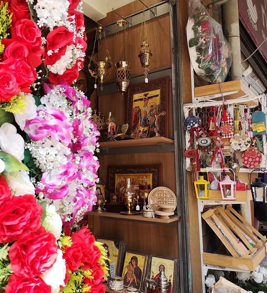 Garlands of pretend flowers, incense holders