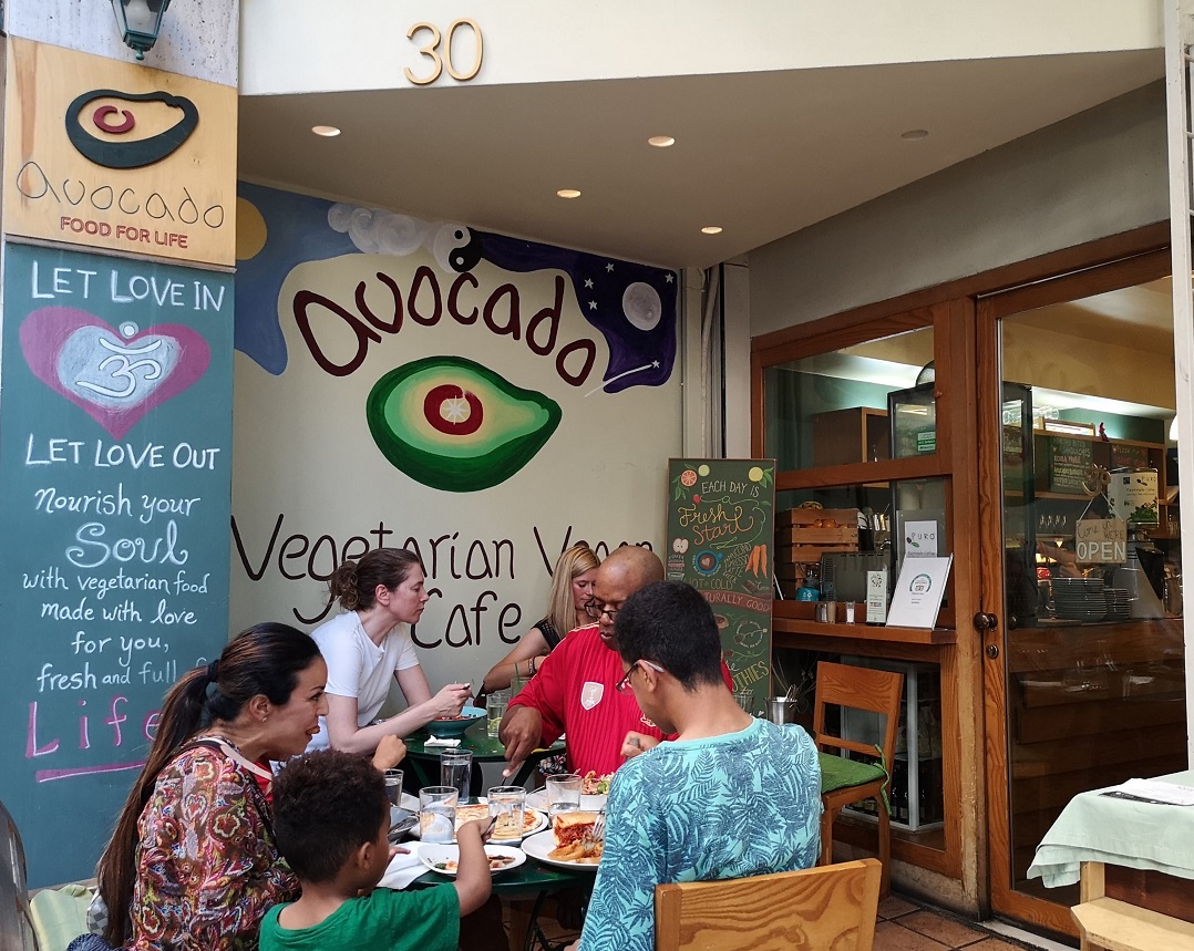 People sitting outside restaurant eating in Athens