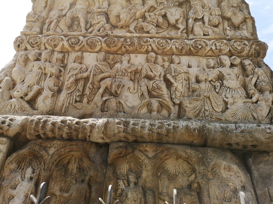 Greek women dance around the pediment 