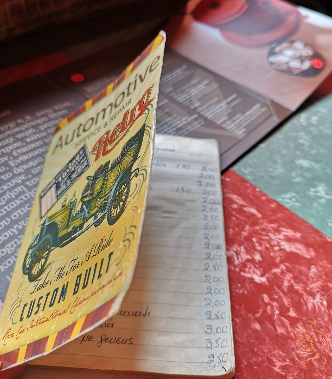 Old car on front of paper menu 