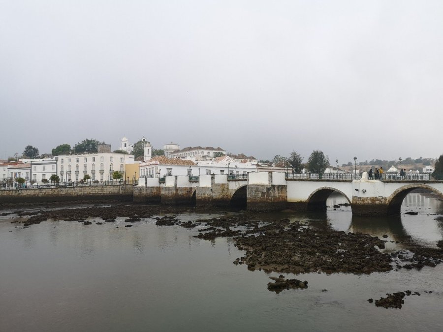 Town buildings of Tavira with Roman Bridge (Ponte Romana) across the river Gilao