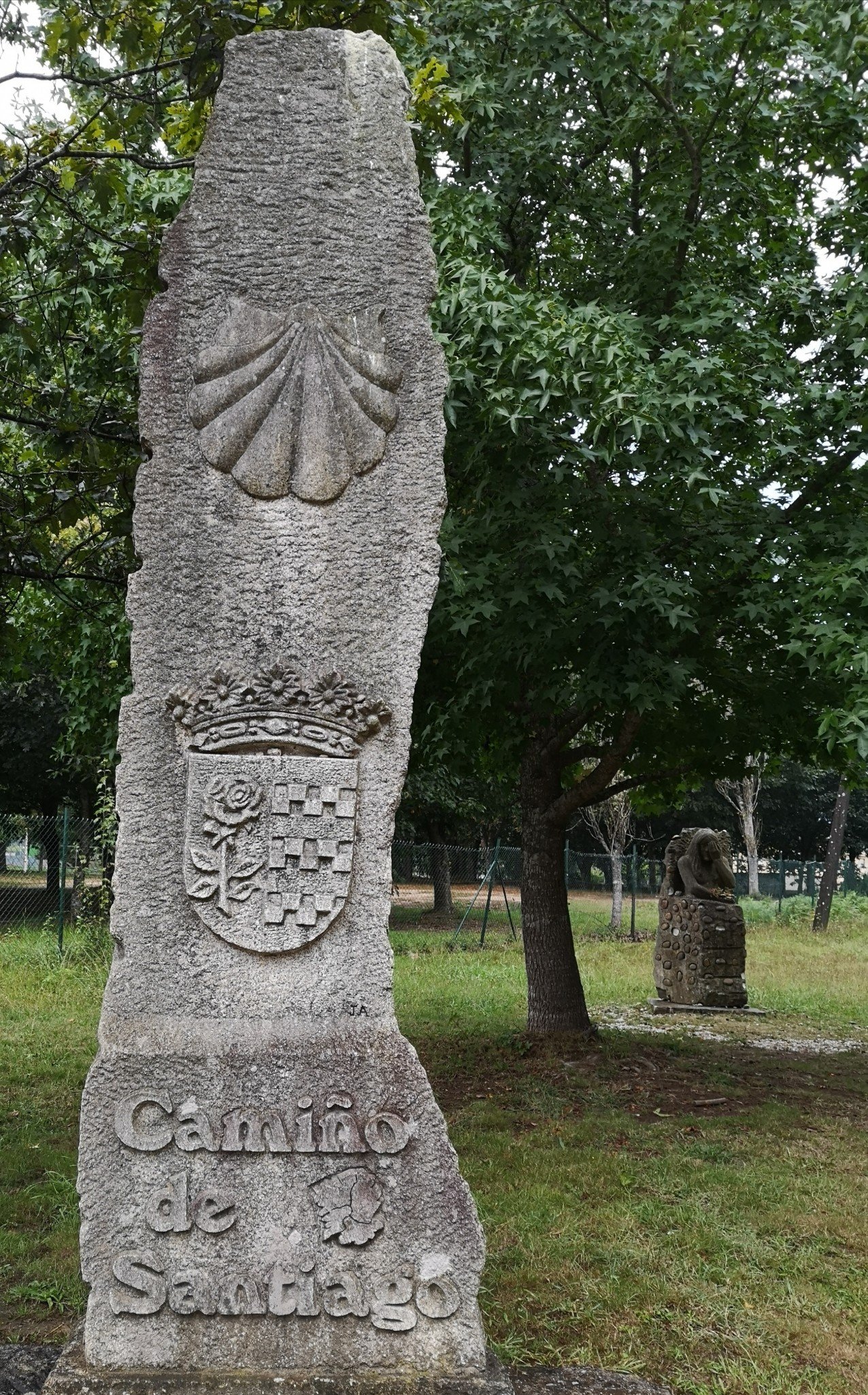 coat of arms camino shell stone marker
