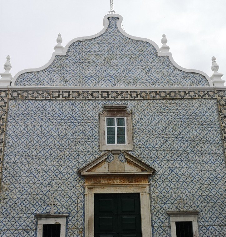 Decorated exterior of building with blue and white tiles in Tavira, Poetugal